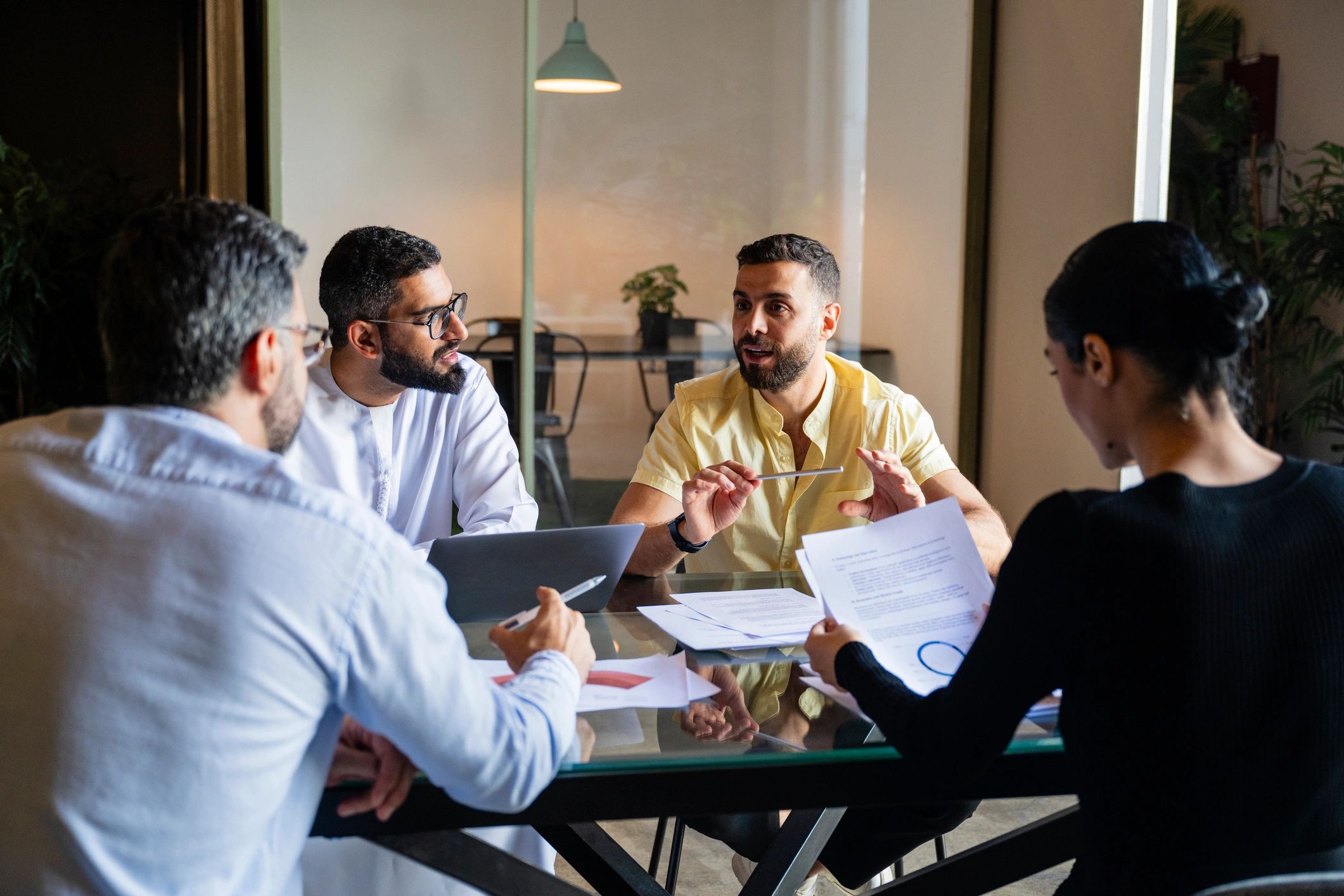Business and development team discussing plans in a meeting