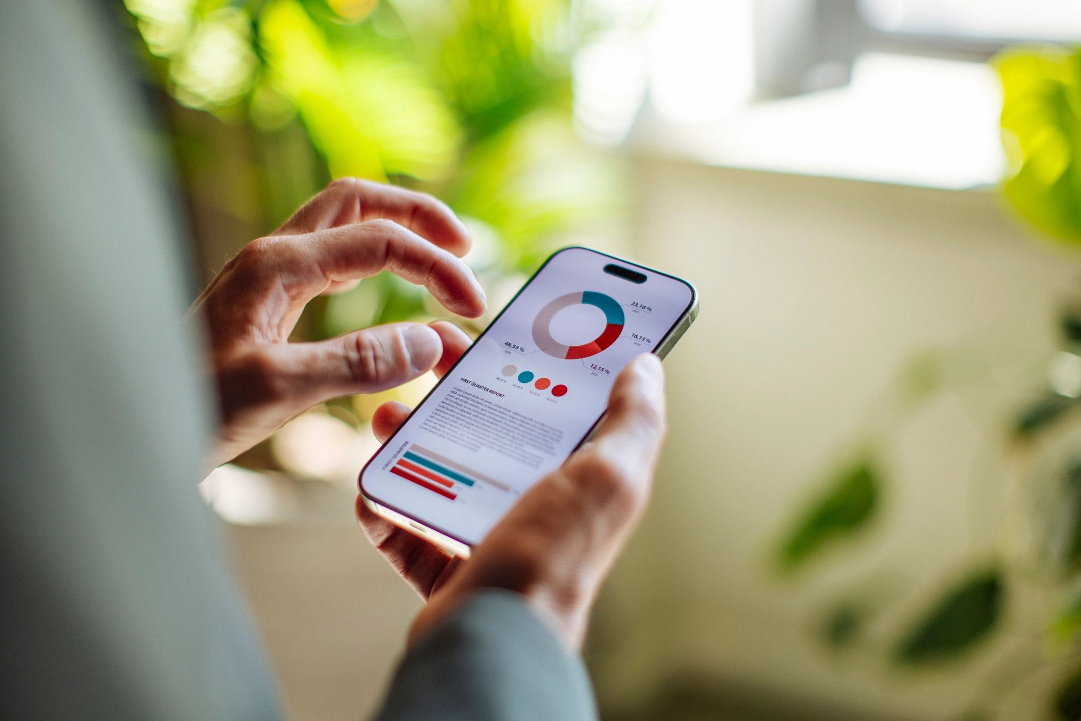 Professional reviewing analytics on a smartphone